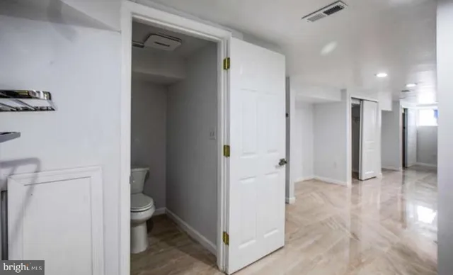 a view of a bathroom with a sink and a mirror