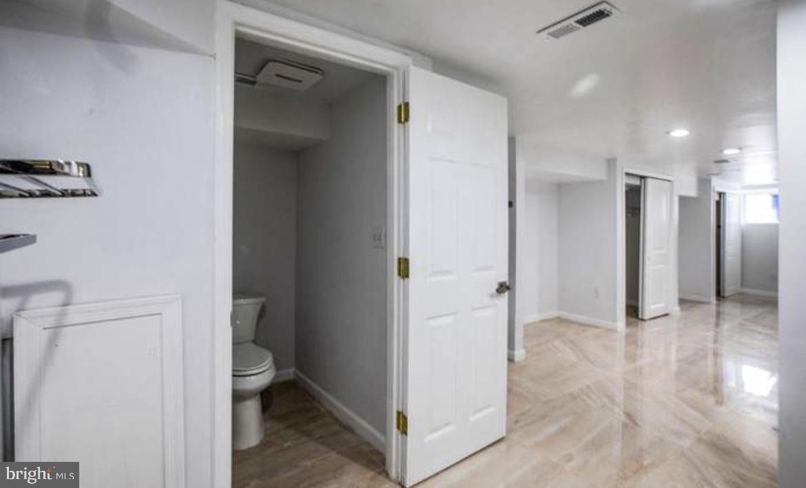 815 North Calhoun Street Baltimore, MD 21217 - Photo 38 of 38 a view of a bathroom with a sink and a mirror