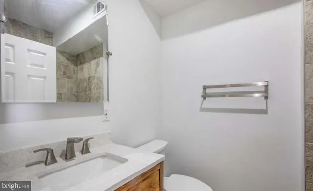 a bathroom with a sink and a toilet