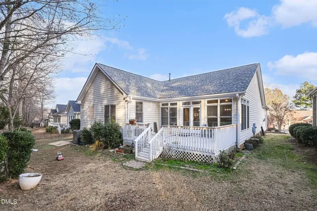 a front view of a house with a yard table and chairs