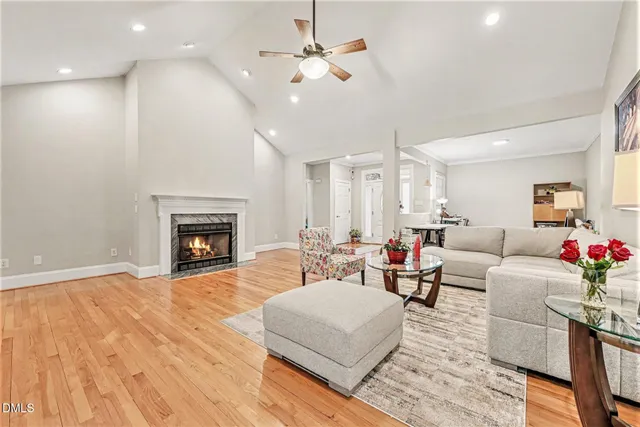 a living room with furniture fireplace and window