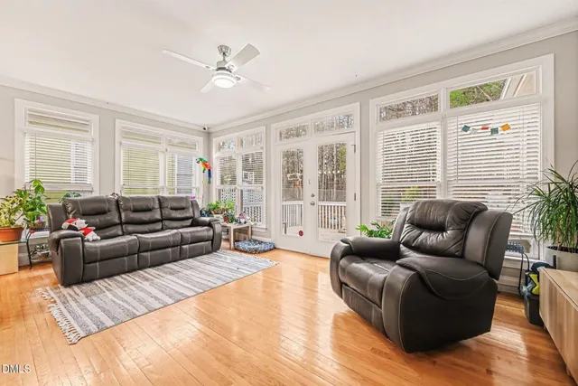a living room with furniture and windows