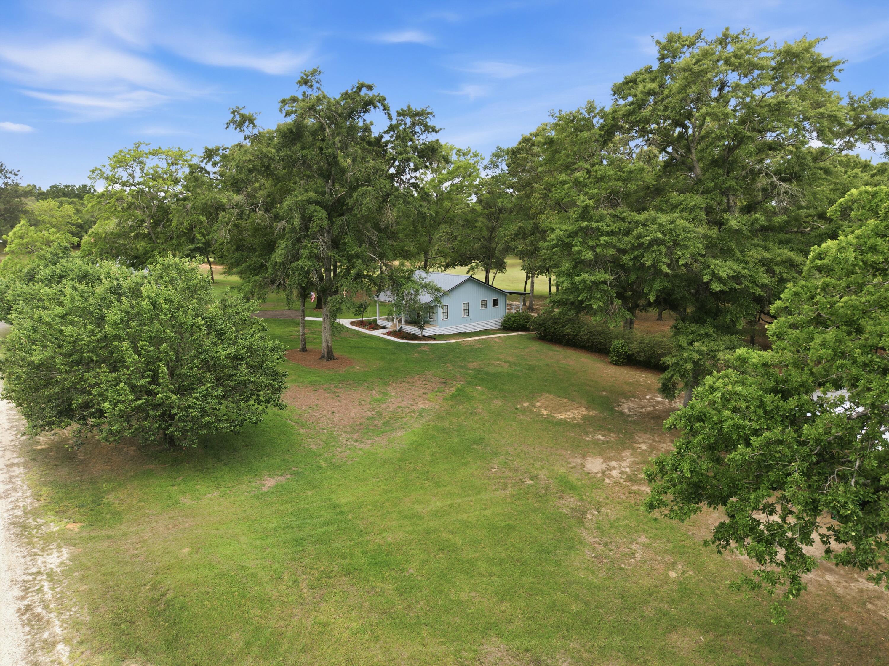 261 Wilkerson Road DeFuniak Springs, FL 32433 - Photo 36 of 76 a view of a lake with houses