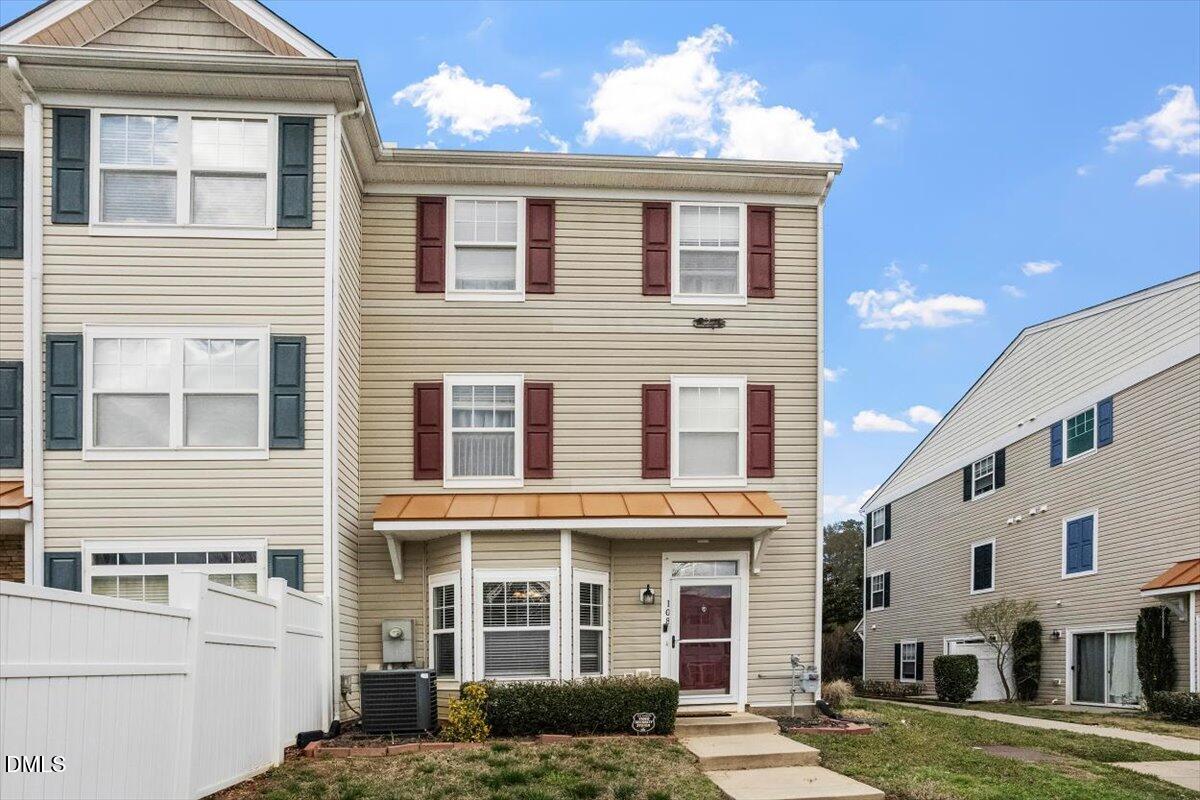 2211 Raven Road, Unit 108 Raleigh, NC 27614 - Photo 1 of 17 a front view of a house with a yard