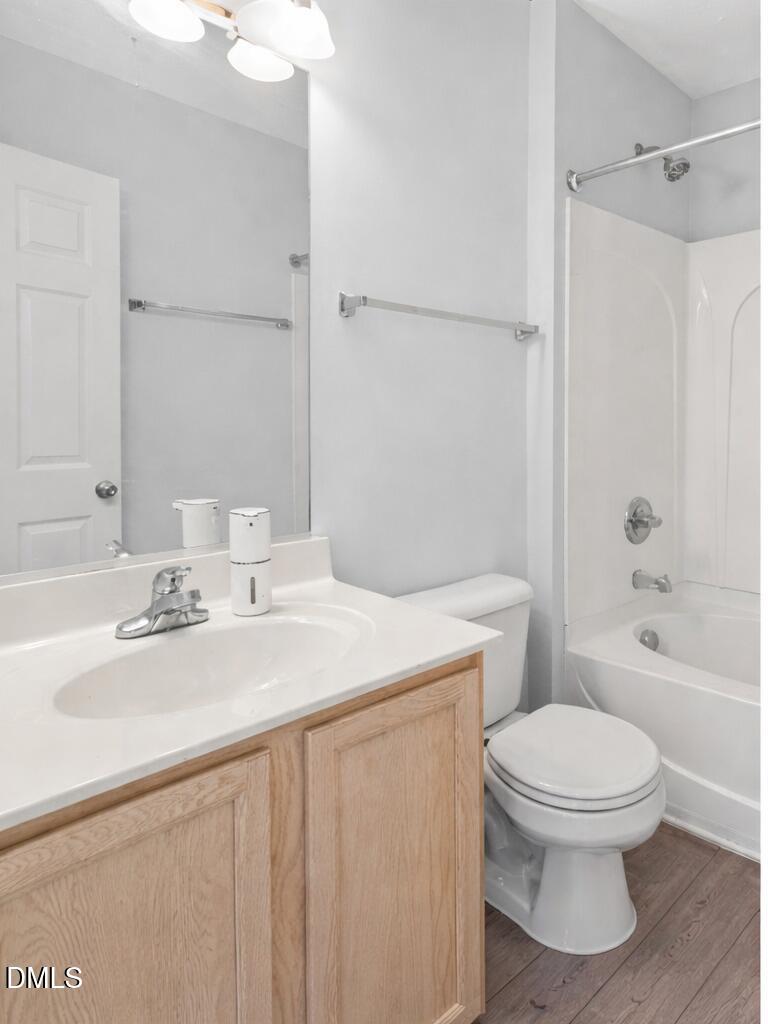 2211 Raven Road, Unit 108 Raleigh, NC 27614 - Photo 12 of 17 a bathroom with a sink a toilet and shower