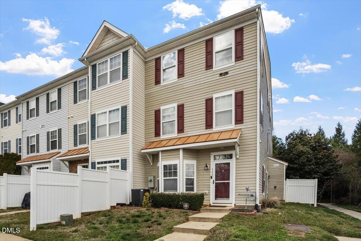 2211 Raven Road, Unit 108 Raleigh, NC 27614 - Photo 3 of 17 a front view of a house with a yard