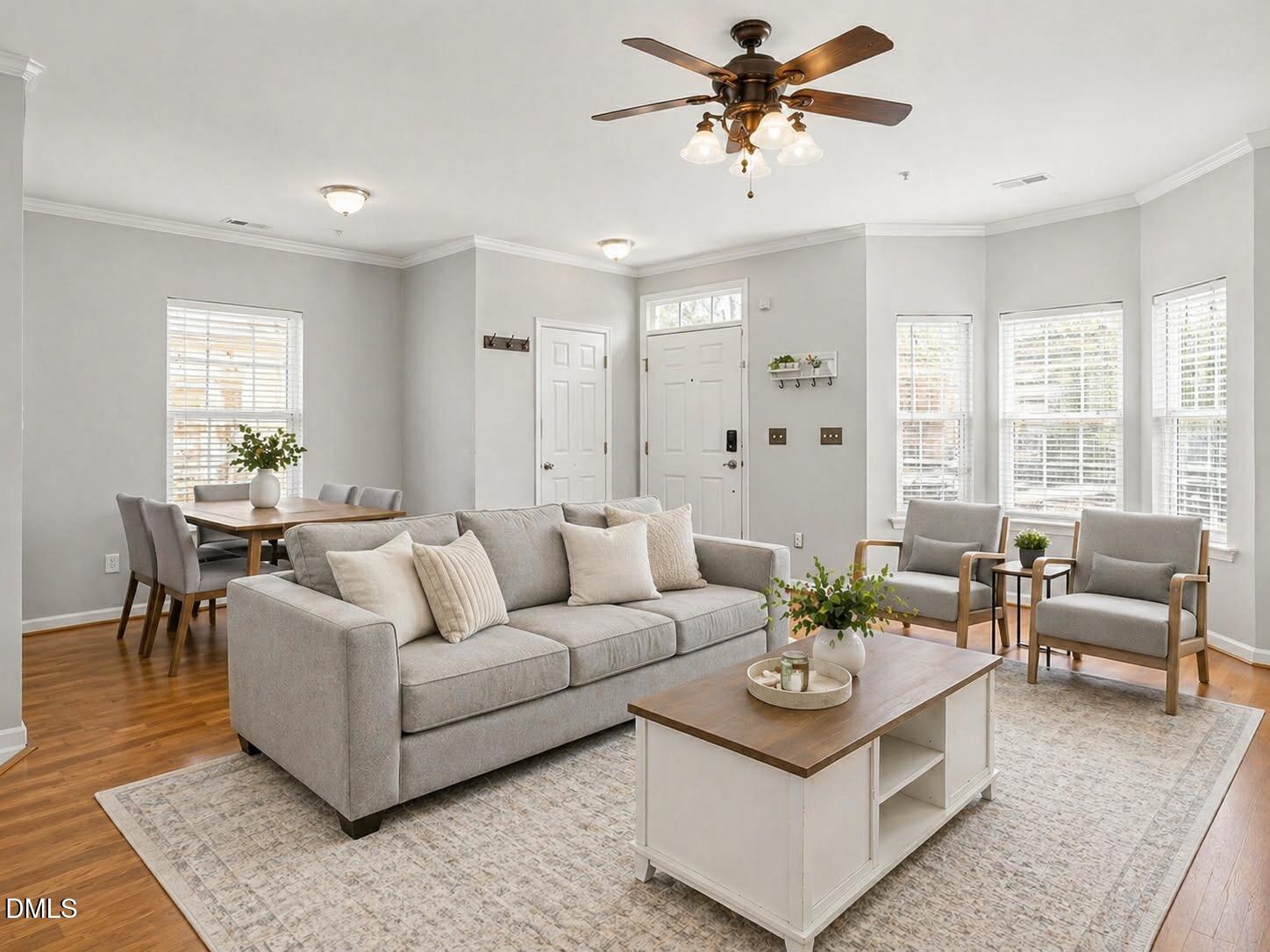 2211 Raven Road, Unit 108 Raleigh, NC 27614 - Photo 4 of 17 a living room with furniture and a large window