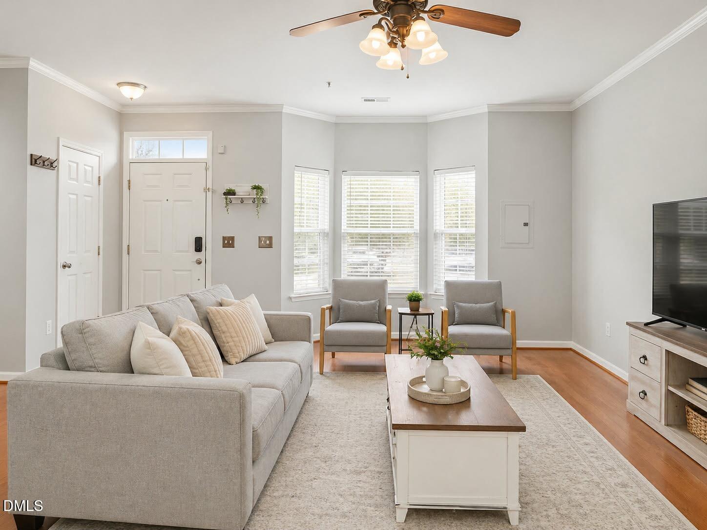 2211 Raven Road, Unit 108 Raleigh, NC 27614 - Photo 5 of 17 a living room with furniture and a flat screen tv