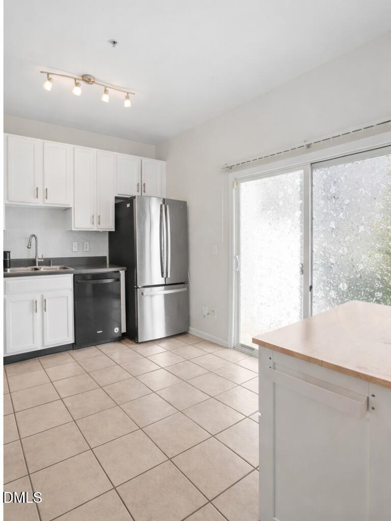 2211 Raven Road, Unit 108 Raleigh, NC 27614 - Photo 6 of 17 a kitchen with stainless steel appliances a refrigerator sink and microwave