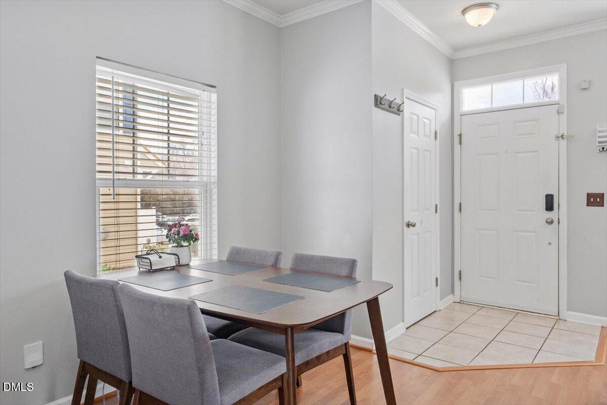 2211 Raven Road, Unit 108 Raleigh, NC 27614 - Photo 7 of 17 a view of a dining room with a table and chairs