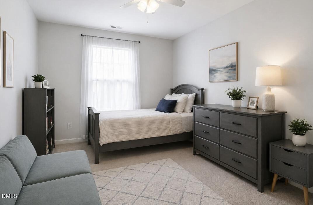 2211 Raven Road, Unit 108 Raleigh, NC 27614 - Photo 8 of 17 a bedroom with a bed and a couch