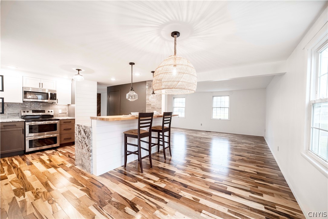 52 Cherry Tree Circle Clay, NY 13090 - Photo 11 of 38 View from the dining area into the kitchen and fro