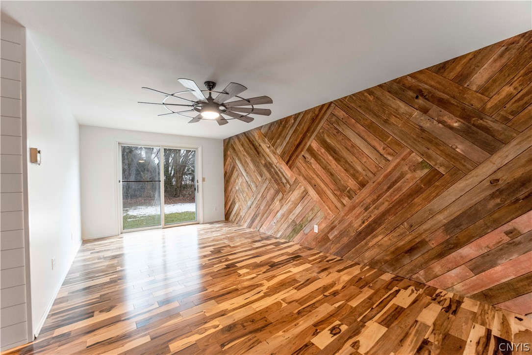 52 Cherry Tree Circle Clay, NY 13090 - Photo 14 of 38 Back family room with barn wood wall feature and s