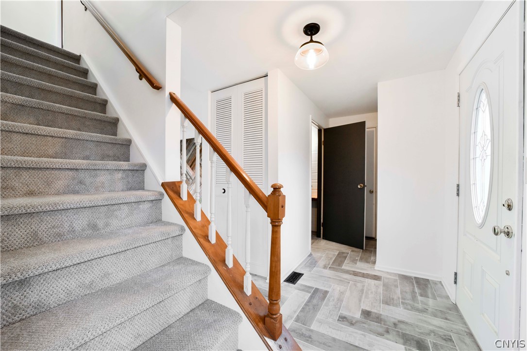 52 Cherry Tree Circle Clay, NY 13090 - Photo 3 of 38 Entry way/foyer with leading to the garage, half b