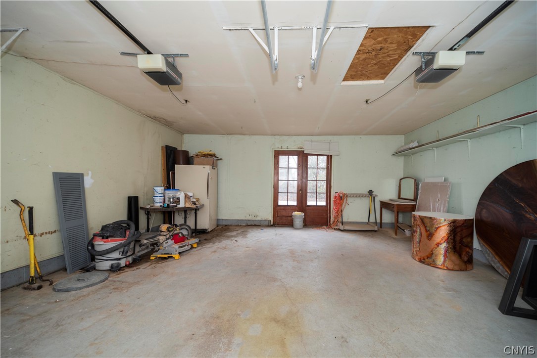 52 Cherry Tree Circle Clay, NY 13090 - Photo 34 of 38 large 2 car garage with access to the back yard.