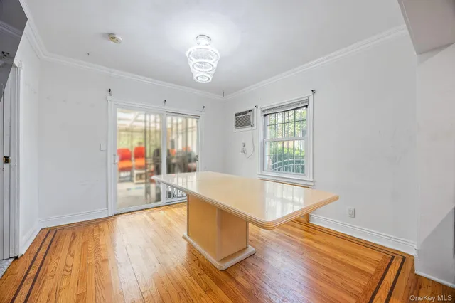 a kitchen with a sink a microwave and cabinets