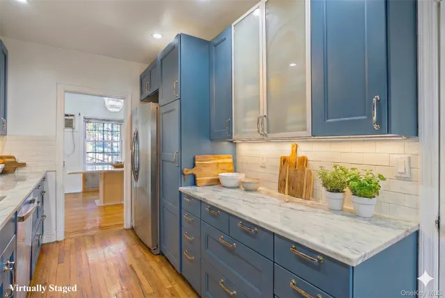 a bathroom with a granite countertop sink a vanity and a shower