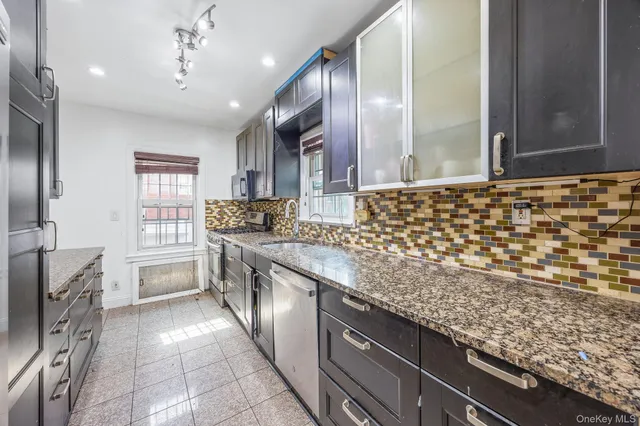 a bedroom with a bed and flat screen tv