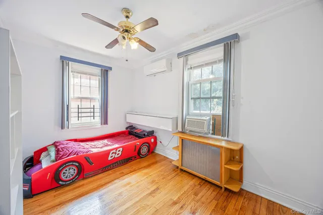 a bathroom with a granite countertop sink a mirror and a shower