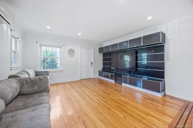 a kitchen with granite countertop wooden cabinets and wooden floor