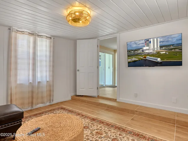 a view of an empty room and window