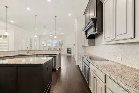 a kitchen with stainless steel appliances granite countertop a sink and stove