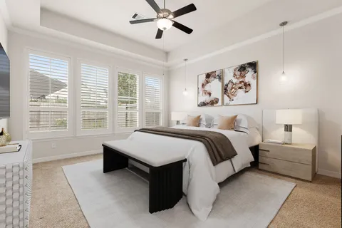 a spacious bedroom with a bed and window