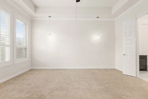 an empty room with a empty space and windows