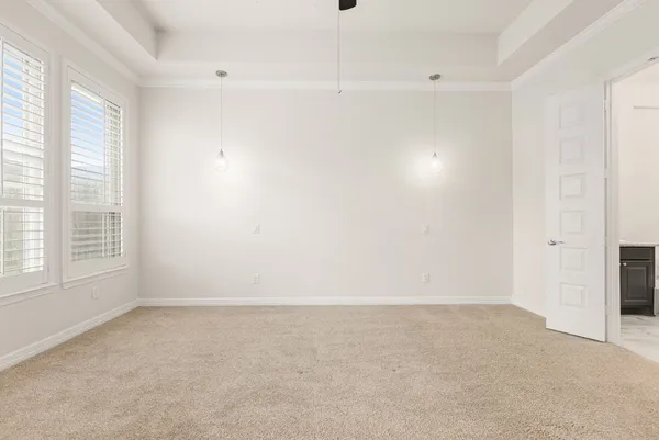 an empty room with a empty space and windows