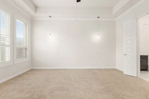 an empty room with a empty space and windows