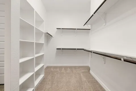 a view of an empty walk in closet