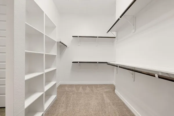 a view of an empty walk in closet