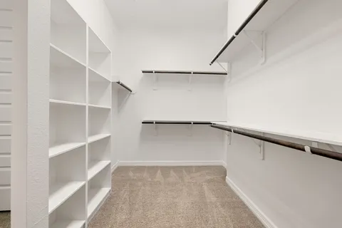 a view of an empty walk in closet