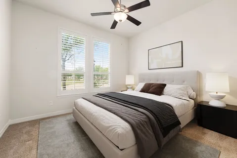 a bed room with a bed and a window