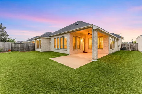a front view of house with yard and porch