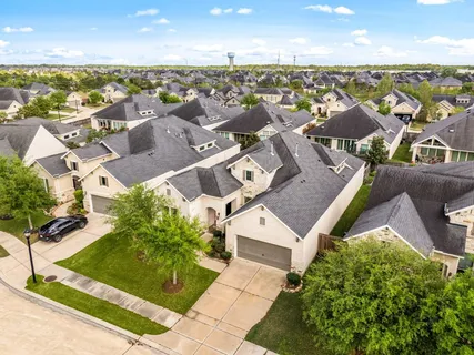 an aerial view of a house with a lake view
