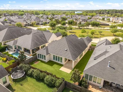 an aerial view of a house with a ocean view