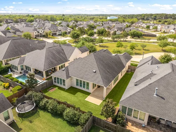 an aerial view of a house with a ocean view
