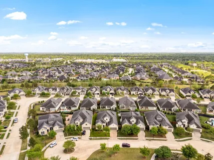 an aerial view of residential building with parking space