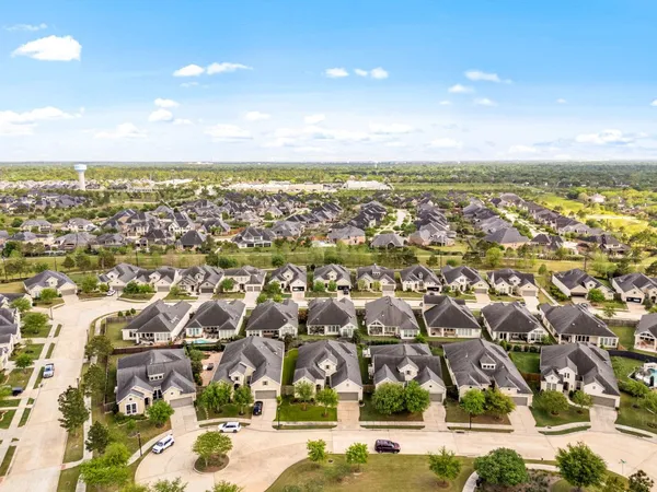 an aerial view of residential building with parking space