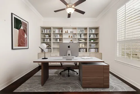 a view of a workspace with furniture