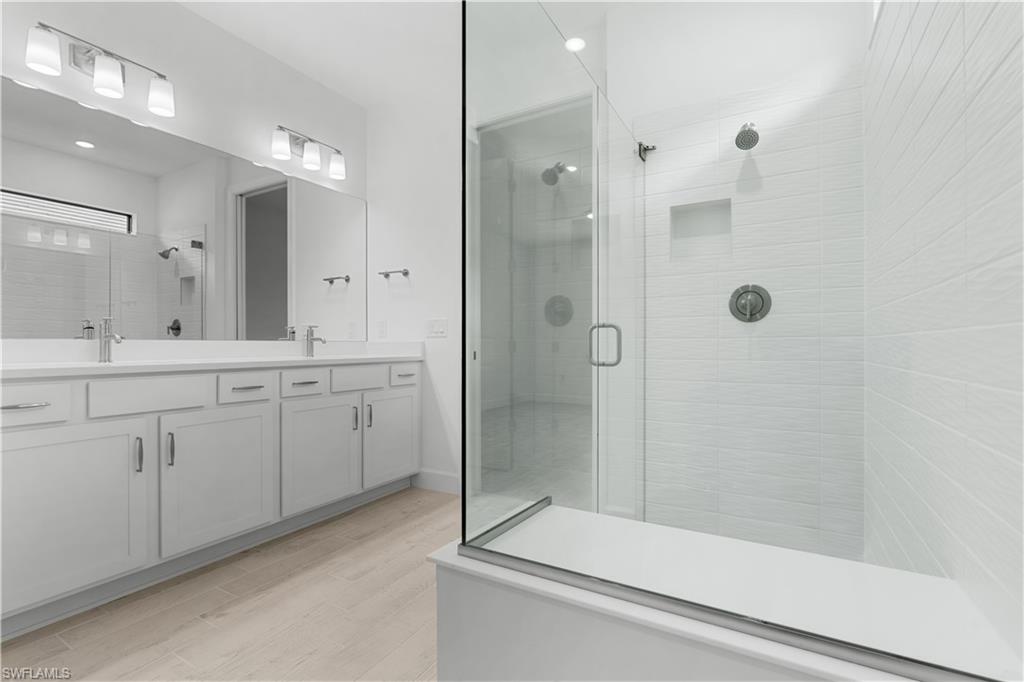 2104 Freemont Way Naples, FL 34119 - Photo 8 of 27 grand primary bathroom with upscale finishes