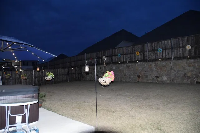 a living room with furniture a flat screen tv and a rug