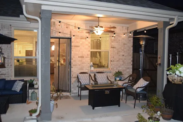 a bedroom with a bed and a flat tv screen on the wall