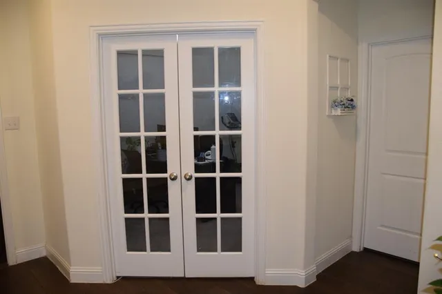 a bedroom with furniture and a chandelier