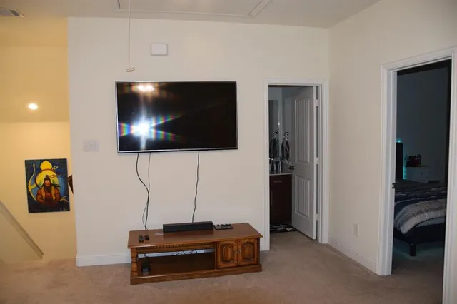 a room with furniture and a flat screen tv