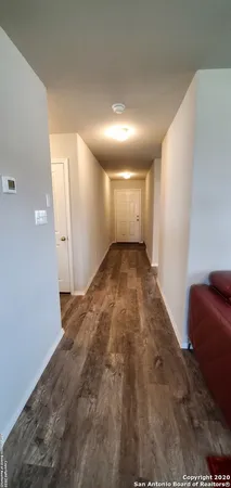 a bathroom with a double vanity sink toilet and a mirror