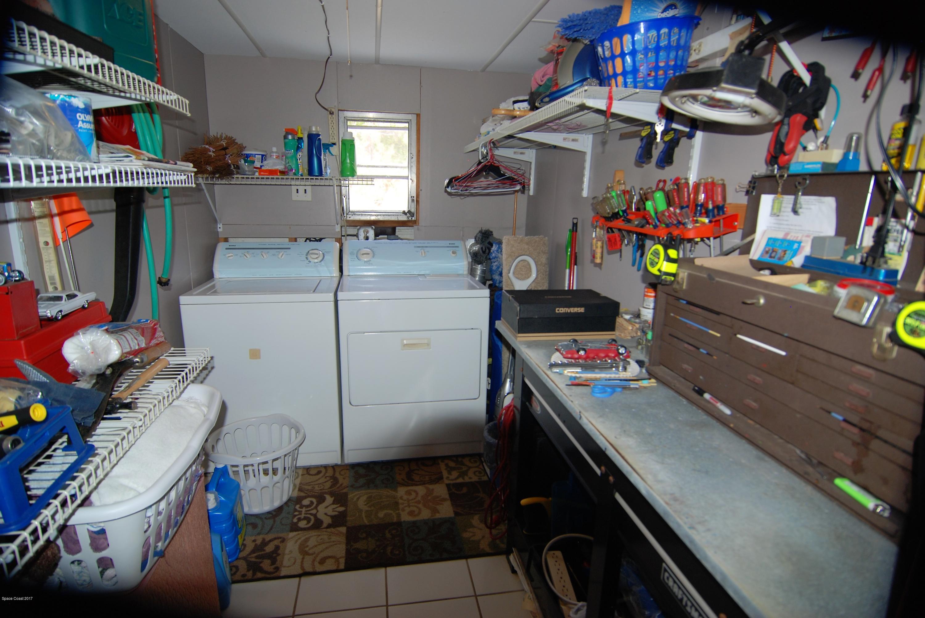 1788 Mango Street Northeast Palm Bay, FL 32905 - Photo 13 of 16 Laundry/Work Bench
