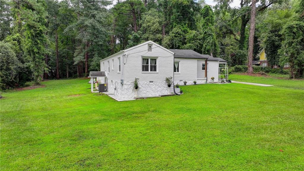 6654 Covington Road Lithonia, GA 30058 - Photo 31 of 39 a view of a backyard of the house