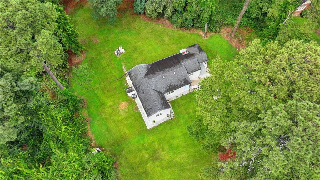 6654 Covington Road Lithonia, GA 30058 - Photo 34 of 39 an aerial view of a house with a yard